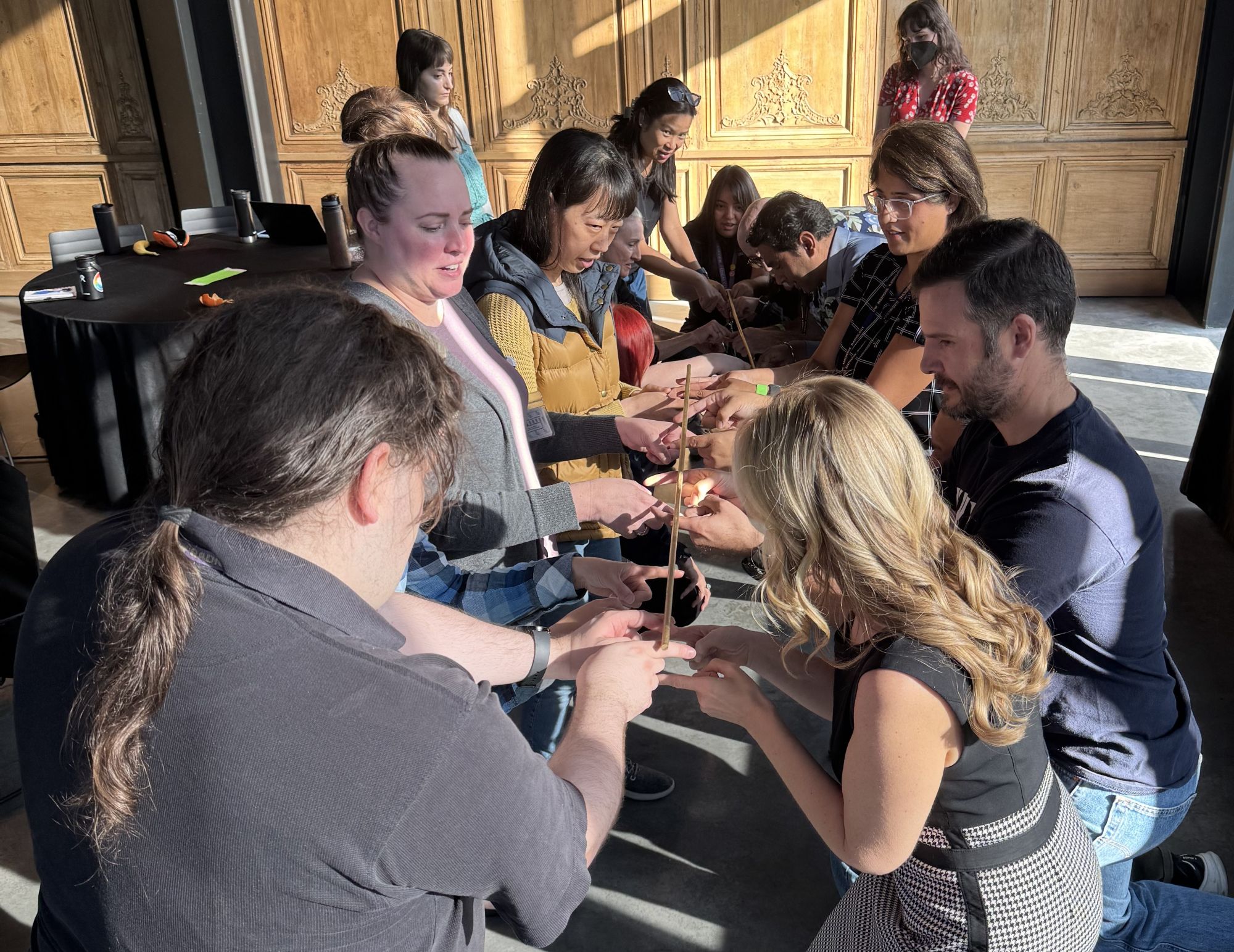 team building activity - balancing a stick together as a team